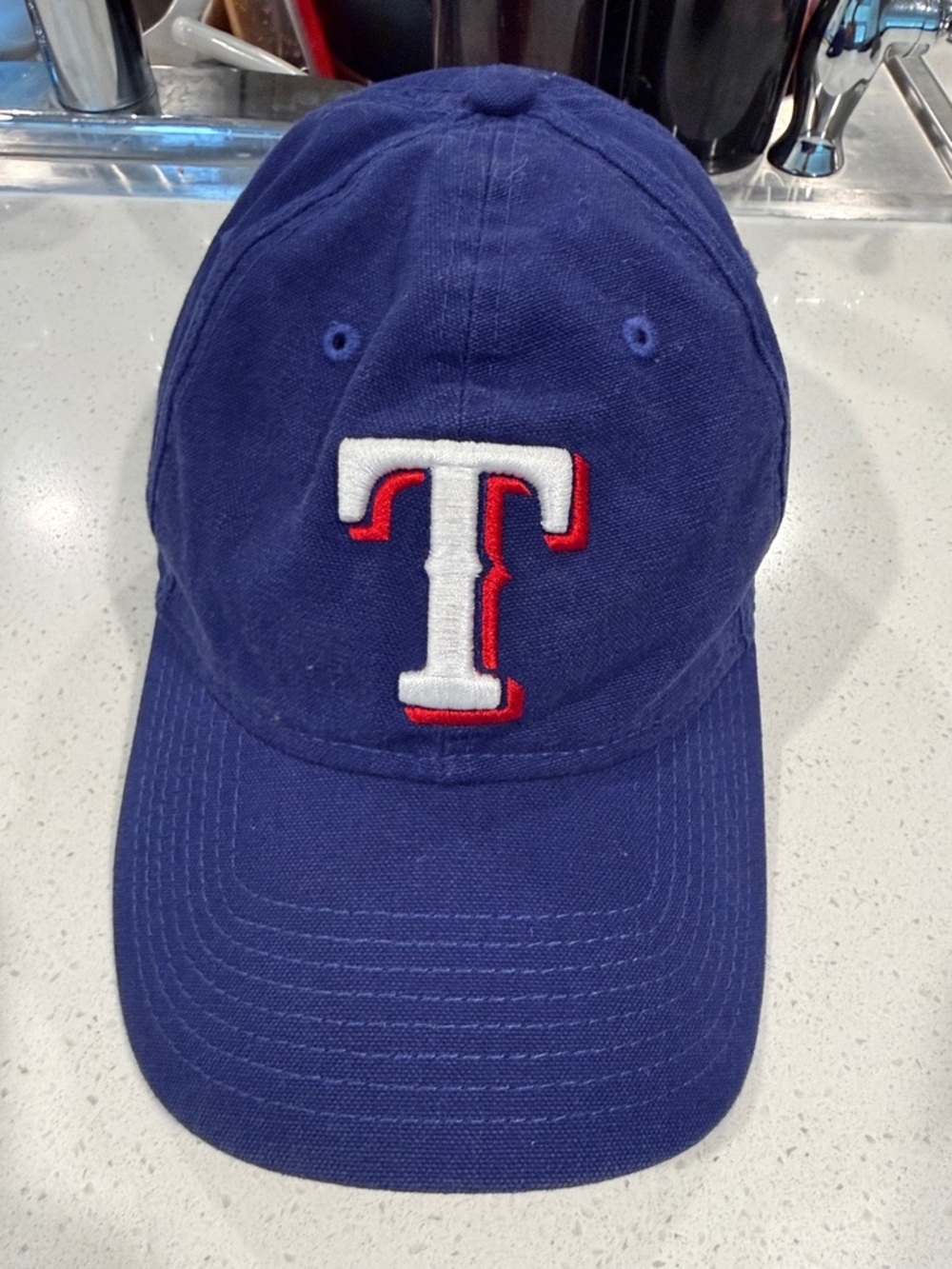 New Era Blue Cap with White and Red Embroidered T